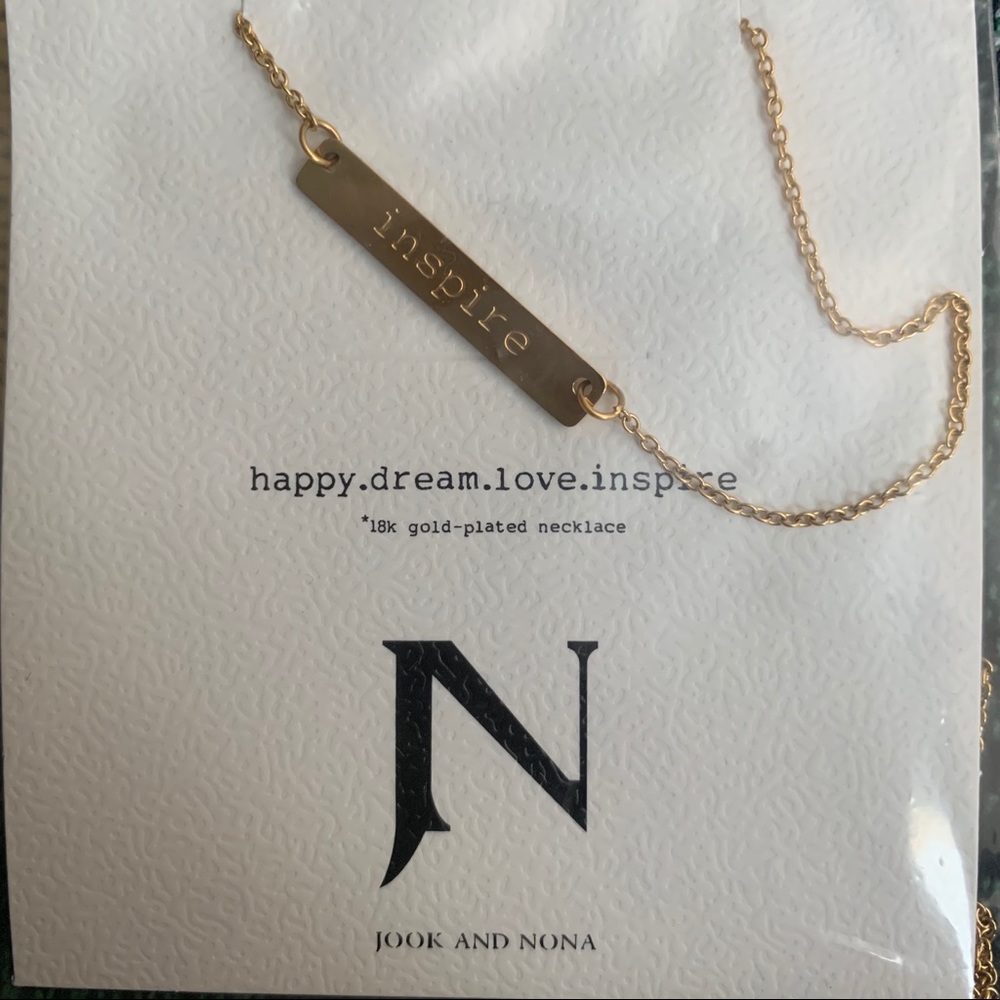Necklace with name plate saying INSPIRE
